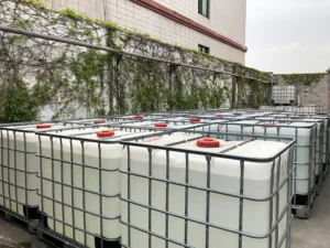Side top view of Fokis woodworking adhesive containers neatly arranged on the floor after production, awaiting loading.